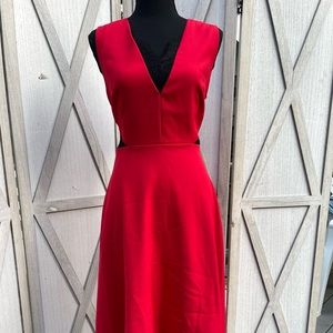 Never worn red dress with black lace details. Hits right below the knees